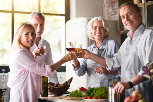 Nice family celebrating together in the kitchen