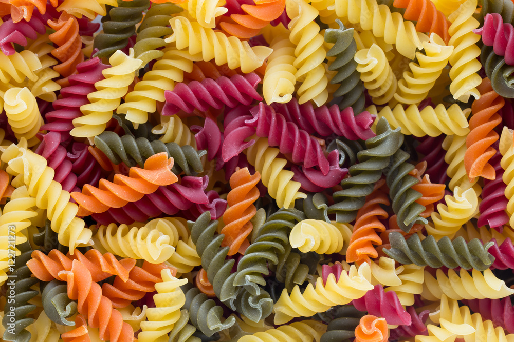 Closeup of raw eco macaroni pasta background.