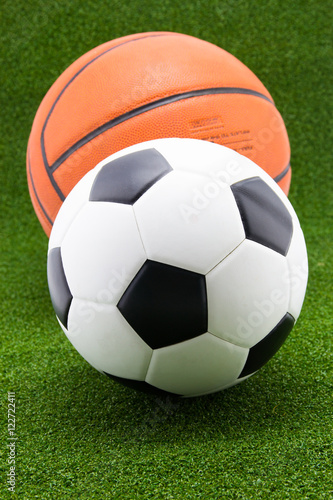 soccer ball with basketball on green grass background