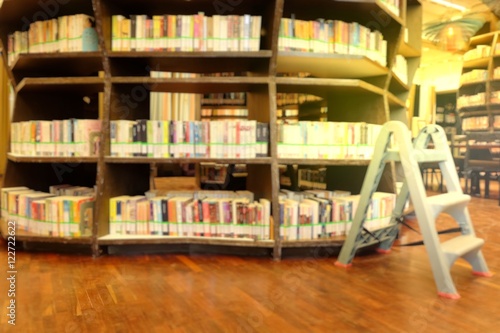 books on bookshelf in library, abstract blur background.Blurred books in public library. Blurred effect. Background.