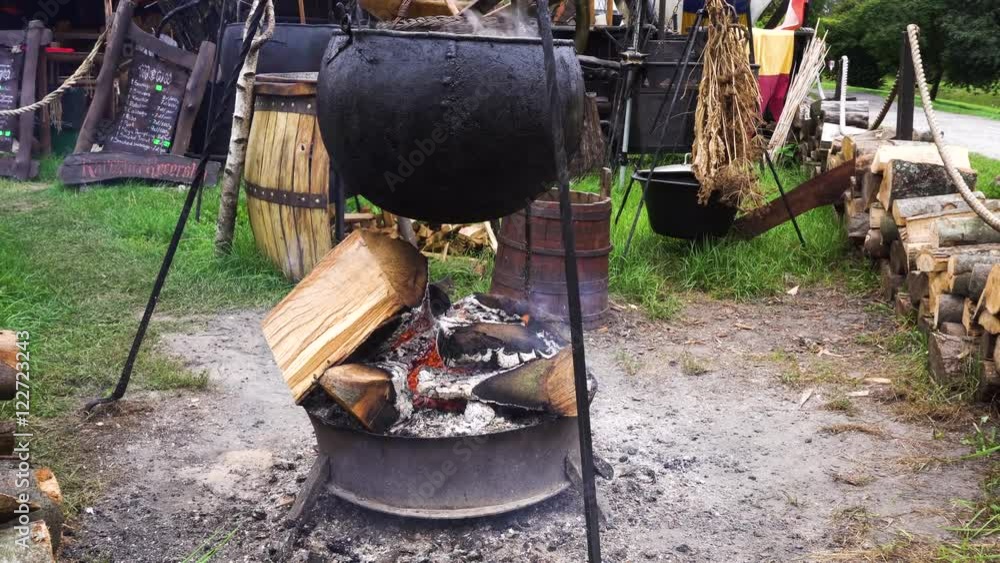 Cooking In a camp In The Cauldron Over fire Cooking In a camp In The Cauldron Over fire