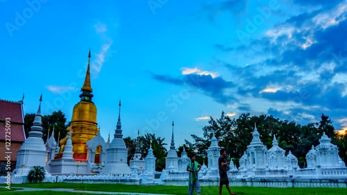 4K,Time lapse day to night, Pagoda at Suandok temple the most famous landmark of Chiang mai province, Thailand.(Camera Zoom In) photo