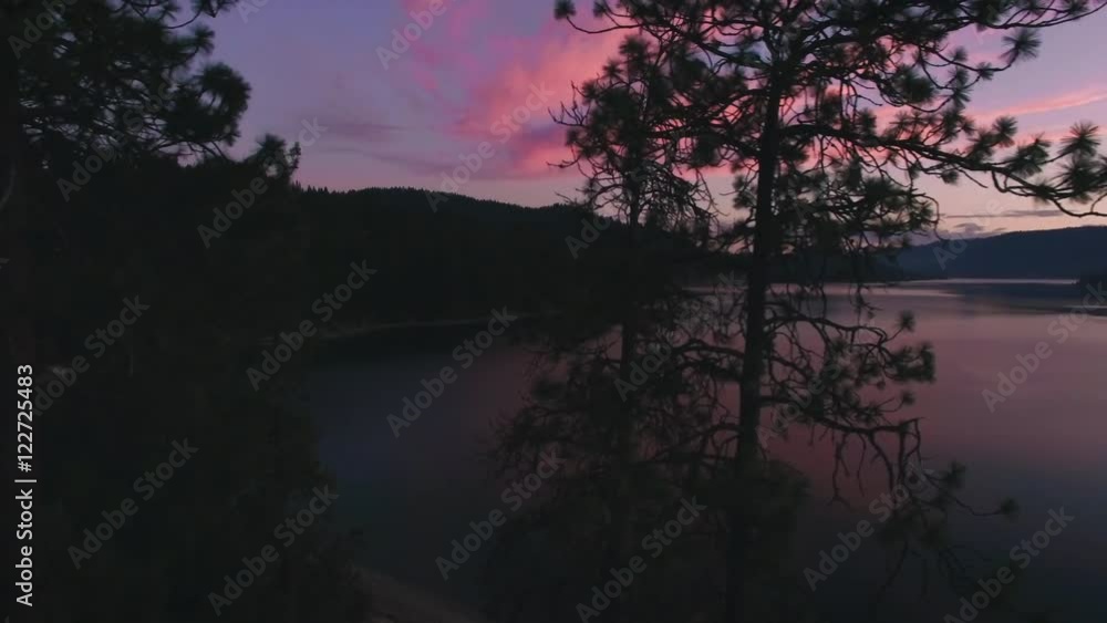 Aerial Dolly Shot to Reveal Pink Clouds Over Big Lake at Dusk Aerial Dolly Shot to Reveal Pink Clouds Over Big Lake at Dusk