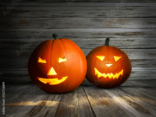 Halloween pumpkin. Jack lantern with candle light inside on wooden background. 3d illustration