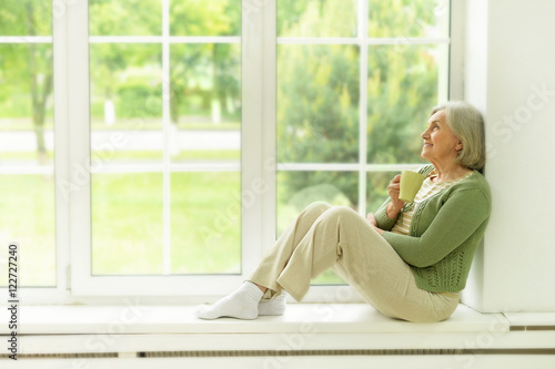 Senior woman portrait with cup of tea