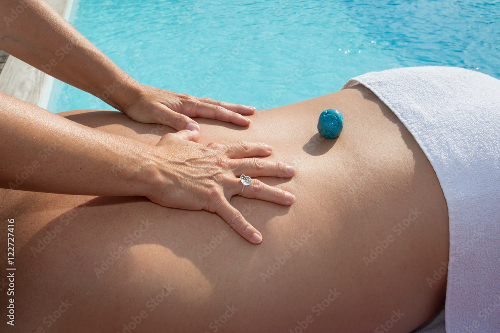 Man having stone massage in a spa salon