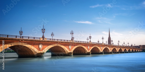 Panorama of Pont de Pierre bridge with St Michel cathedral in Bordeaux, France