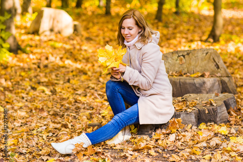 young blonde woman portrait in autumn nature © satura_