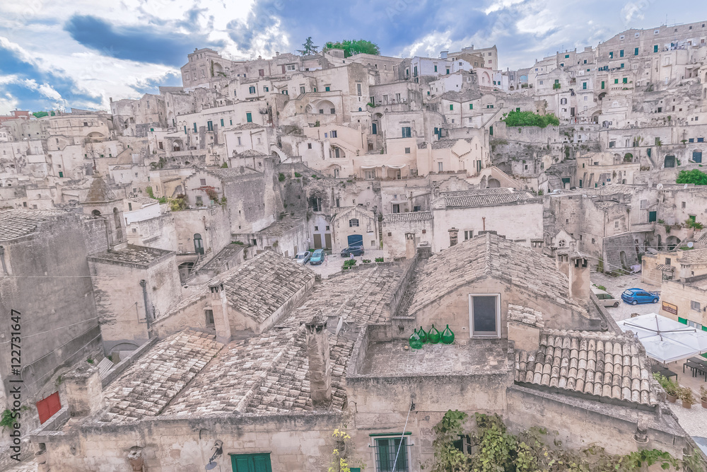 typical house of stones (Sassi di Matera)  of Matera under blue sky. Matera in Italy