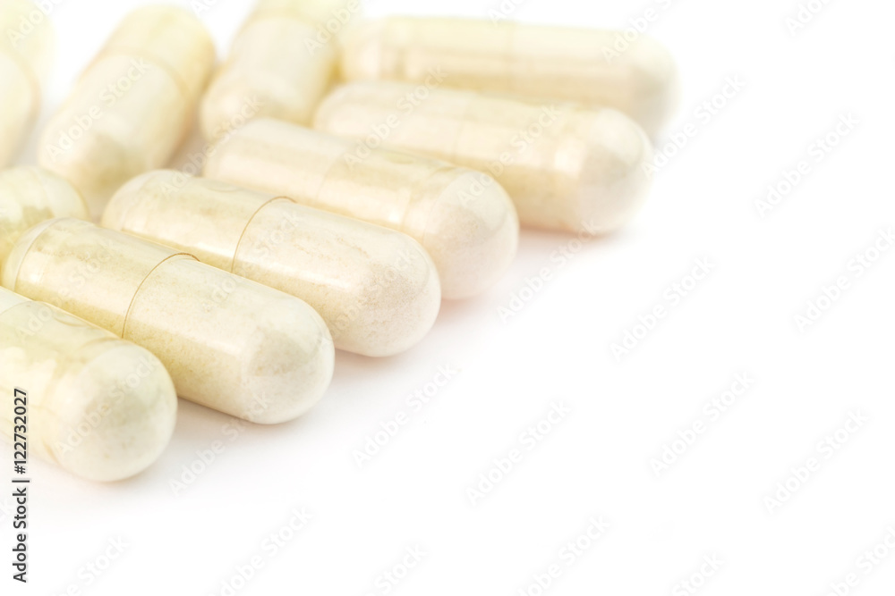 Food supplement pills, glucosamine capsules, isolated on white background, macro image Food supplement pills, glucosamine capsules, isolated on white background, macro image