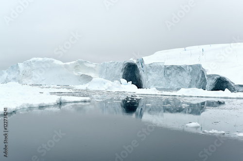 Icebergs are on the arctic ocean, Ilullisat, Greenland. May 16, 2016. photo