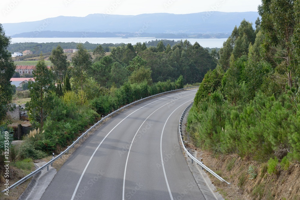 view of the turn of the highway between the mountains