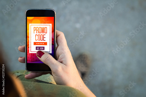 Woman walking smartphone promo code