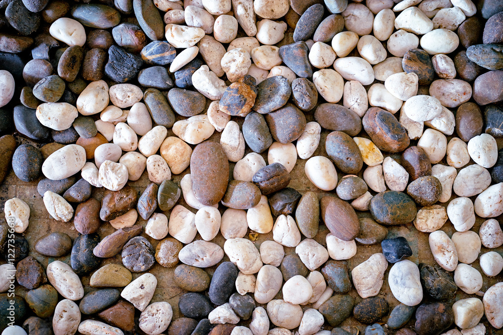 Naklejka premium Pebbles stone background.