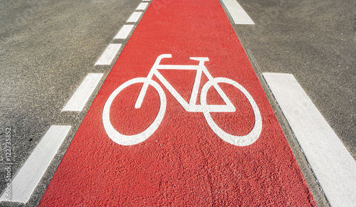 Red bicycle path with a bicycle symbol