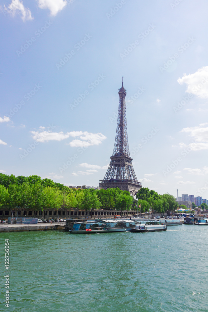 famous Eiffel Tour over water of Seine river, Paris, France