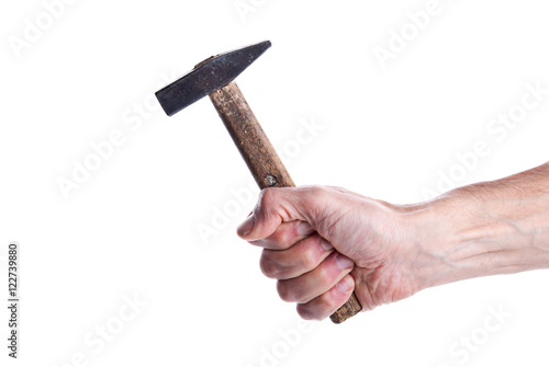 Hammer in a man's hand on an isolated background