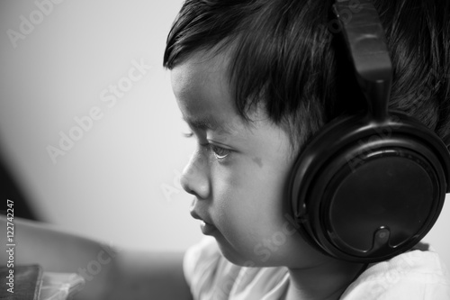 Asian boy ware headphone black and white image