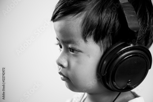 Asian boy ware headphone black and white image