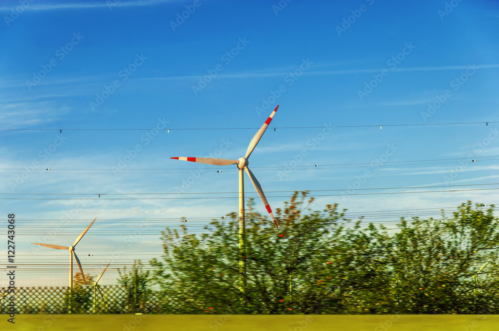 Fototapeta premium Wind turbine green field nature concept