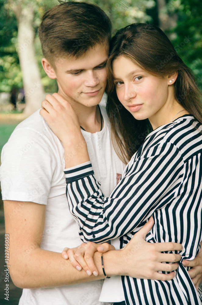 Romantic couple together in a park in autumn Romantic couple together in a park in autumn