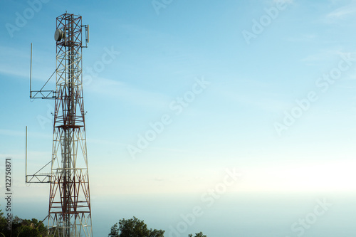 Cellular communication tower in blue sky background