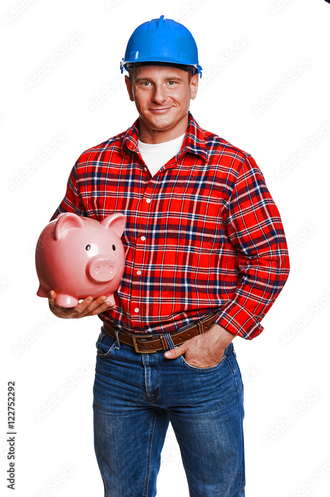 Fotografie Construction worker with piggy bank.