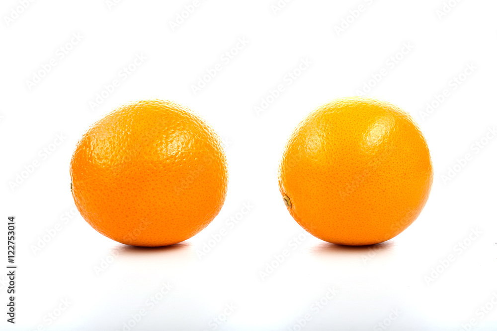 Bananas, oranges and pineapple on the table on a white backgroun Bananas, oranges and pineapple on the table on a white backgroun
