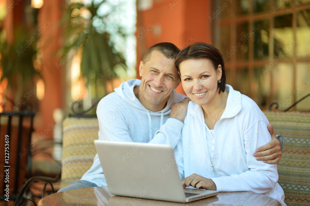Happy couple with laptop Happy couple with laptop