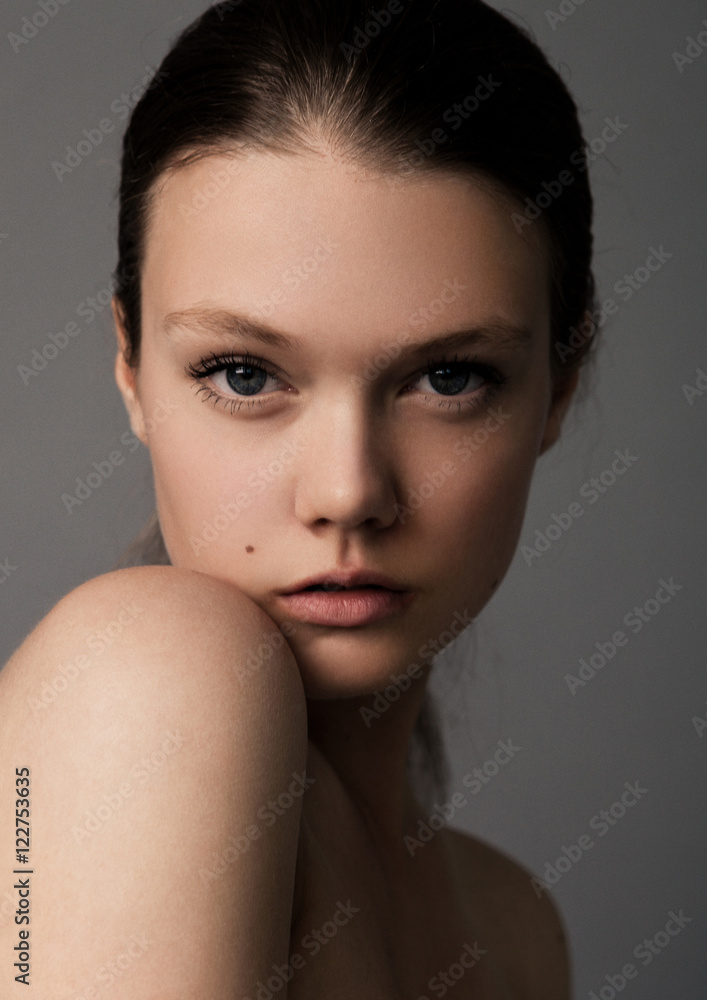 Fototapeta premium Portrait of beautiful young girl with shoulder