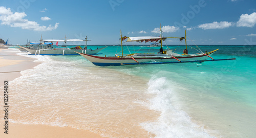 traditional filipino asian ferry taxi tour boats on puka beach i photo