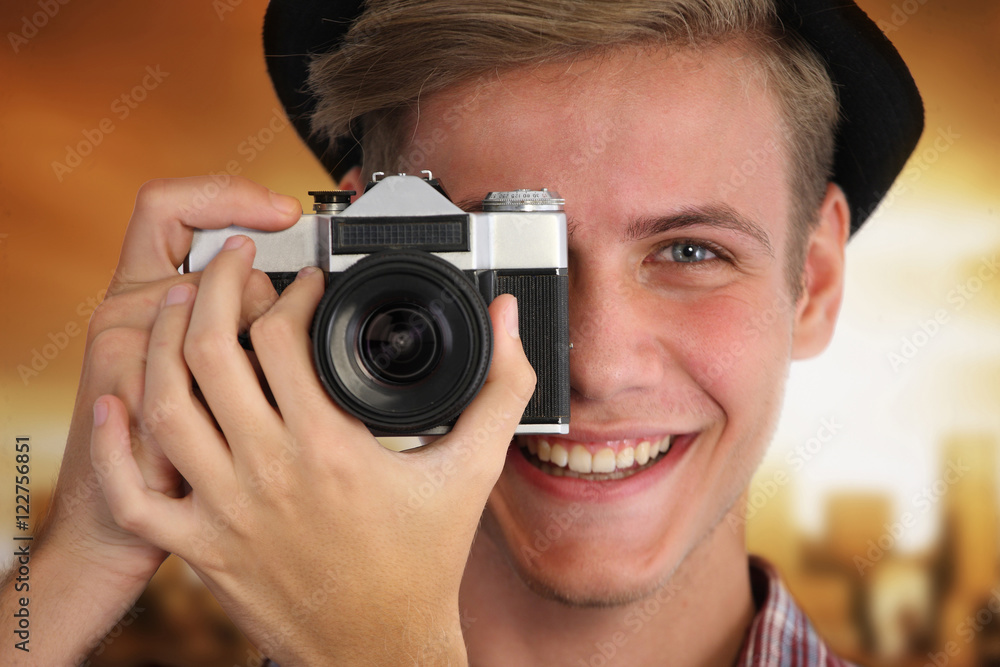 Portrait of a young hipster taking pictures Portrait of a young hipster taking pictures