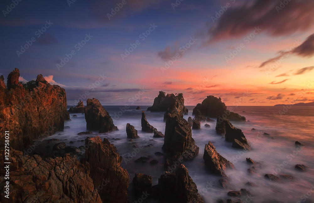 Sunset at stone shark teeth. Amazing locations in Pegadung Beach Lampung, Indonesia.
