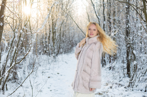 Model in winter forest