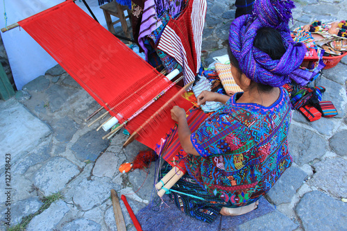 Mayan woman working with a loom in Guatemala