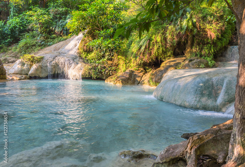 Jangle landscape with flowing turquoise water of seven step Eraw