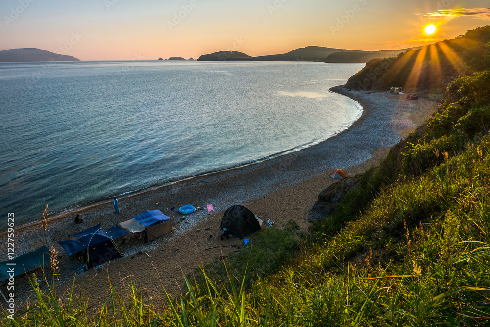 Fototapeta sunset camping view on the beach of russian isle Putyatin