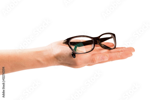 hand giving eyeglasses. isolated on white background