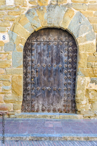 Old door in Monells, Spain © kovgabor79