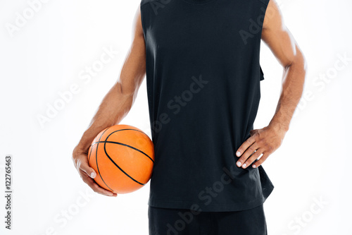 Cropped image of an african basketball player holding ball