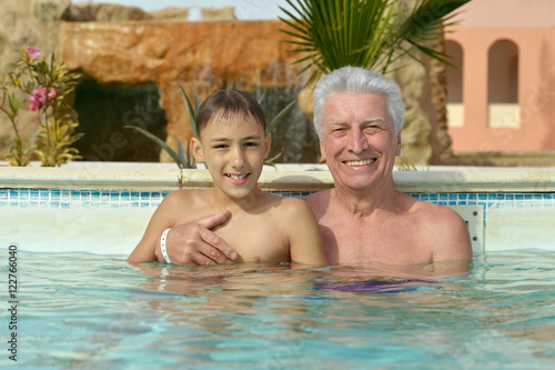 Grandfather with grandson in  pool © aletia2011