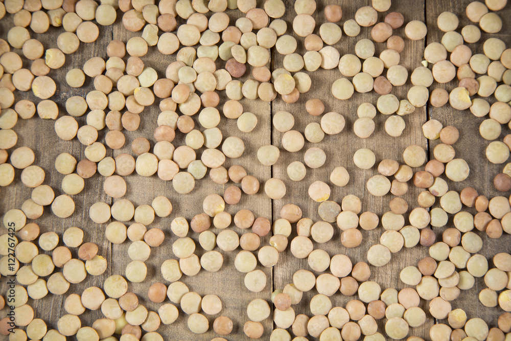 Lentil beans on wooden table - Lens culinaris Lentil beans on wooden table - Lens culinaris