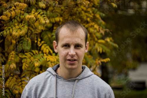 Photo of a smiling young man close up