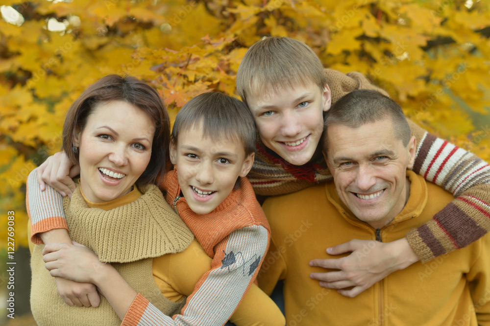 Fototapeta premium Happy family in autumn forest
