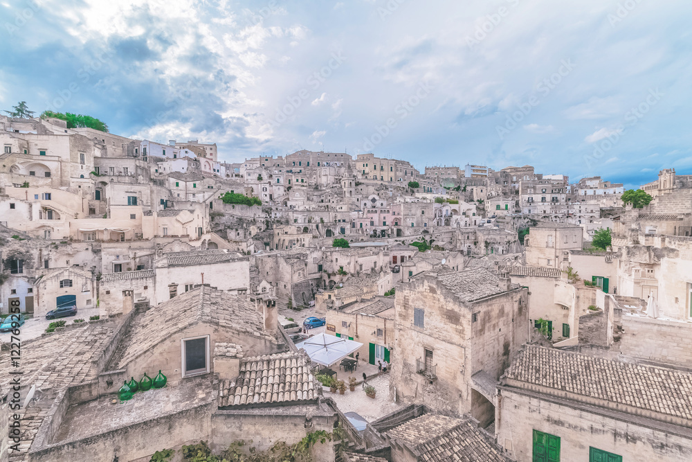typical view of stones (Sassi di Matera)  of Matera under blue sky. Matera in Italy