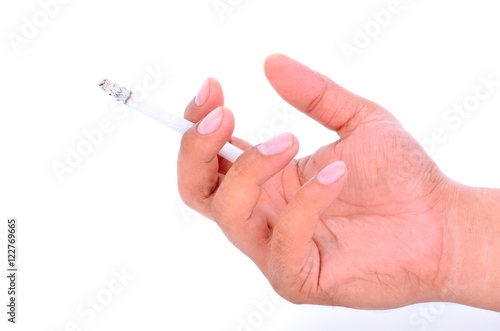 Cigarette in a fingers on white background