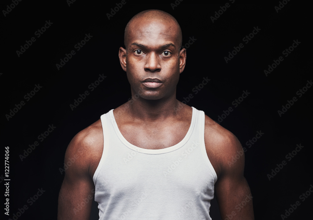 Serious young black man in undershirt Serious young black man in undershirt