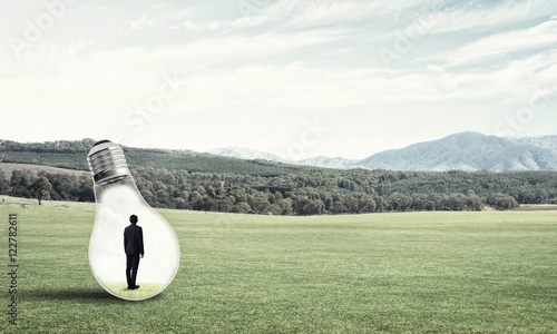 Businessman inside light bulb