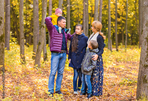 Portrait Of Happy Family on autumn nature