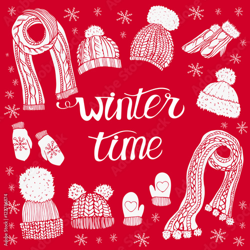 Winter clothes set on red background.